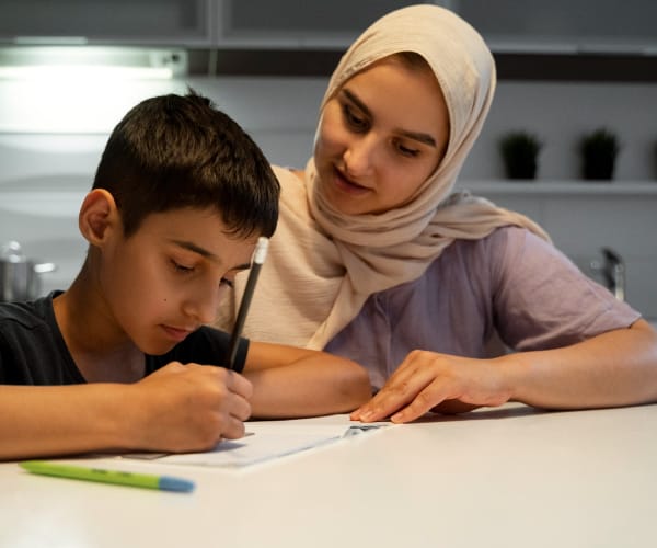 Boy writing his homework